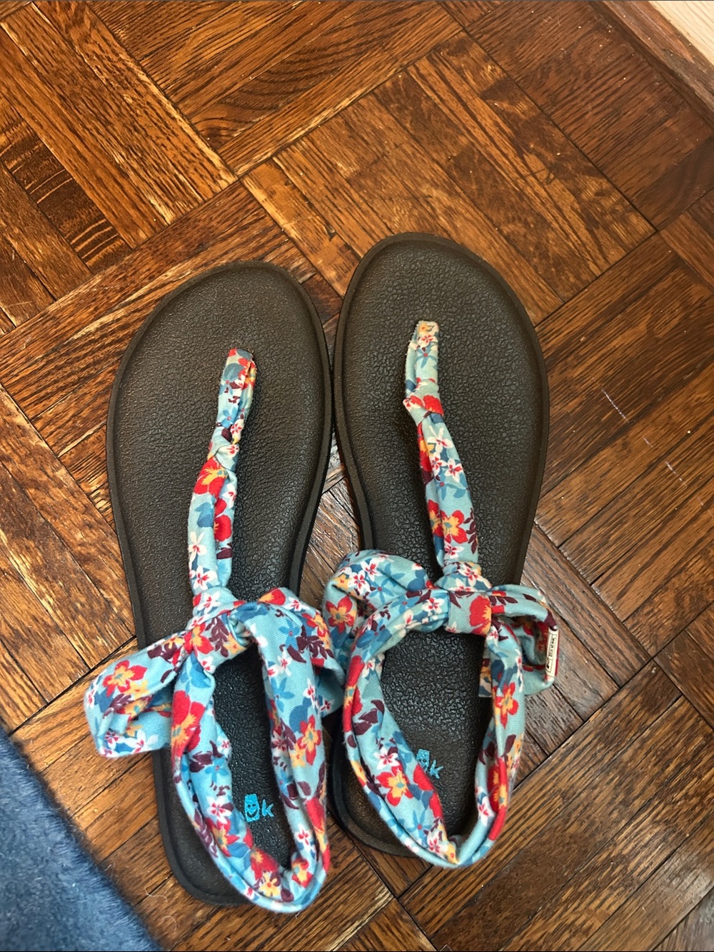 Sanuk Black Footbed Sandals with Blue Floral Wrap Straps